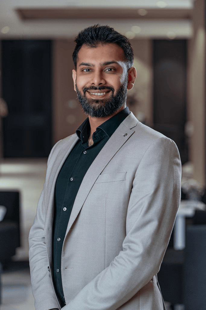 Harris, Precision Health Clinic team member, professional headshot in light blazer