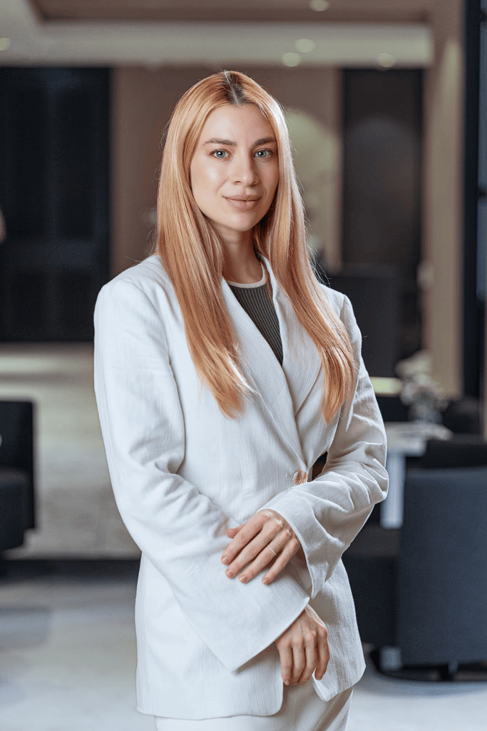 Kateryna, Precision Health Clinic team member, professional headshot in white blazer